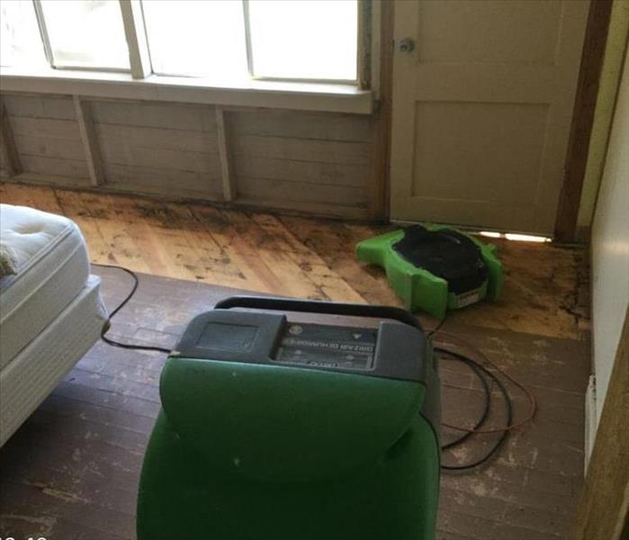 dehu and air mover placed in enclosed porch with wood deck
