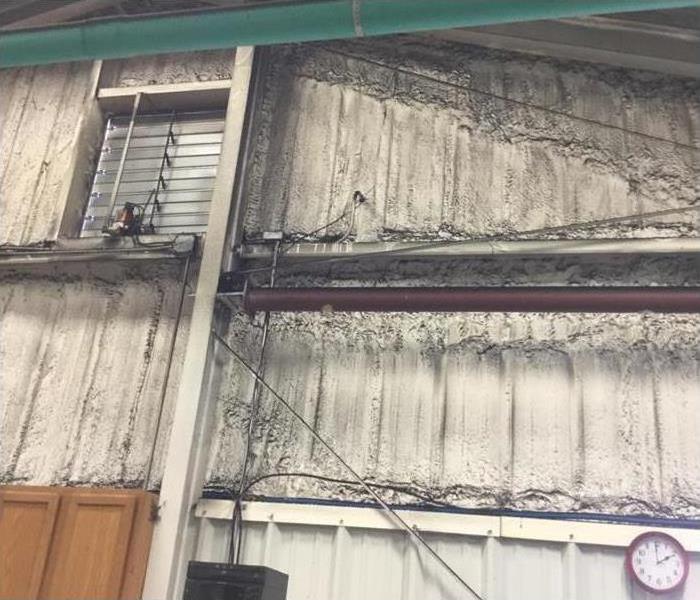 dirty soot stuck on metal walls