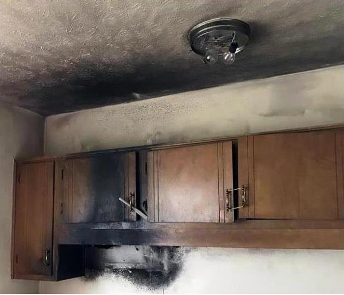 burned walls, cabinets and ceiling in a kitchen